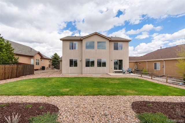 rear view of property featuring stucco siding, a patio area, and central AC unit