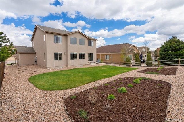 rear view of property featuring a patio area and stucco siding