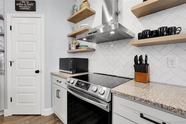 484 N Jamestown Way, Aurora, CO 80018 - kitchen featuring open shelves, wall chimney exhaust hood, electric range, backsplash, and black microwave