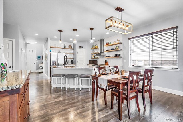 484 N Jamestown Way, Aurora, CO 80018 - dining area with recessed lighting, dark wood-type flooring, and baseboards