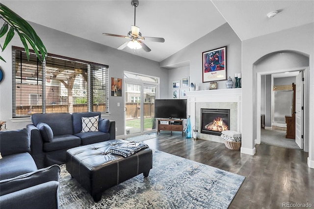 484 N Jamestown Way, Aurora, CO 80018 - living room with lofted ceiling, ceiling fan, a fireplace, wood finished floors, and baseboards