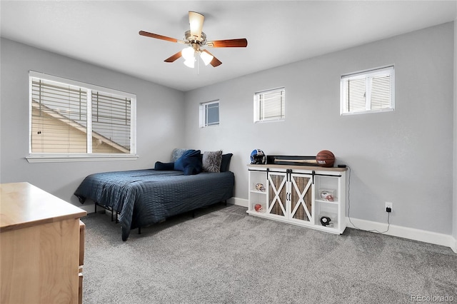484 N Jamestown Way, Aurora, CO 80018 - bedroom with carpet floors, baseboards, and a ceiling fan