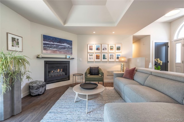 995 Chase St, Lakewood, CO 80214 - living room featuring a glass covered fireplace, dark wood finished floors, a raised ceiling, and recessed lighting