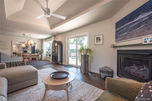 995 Chase St, Lakewood, CO 80214 - living room with wood finished floors, ceiling fan, a glass covered fireplace, and a raised ceiling