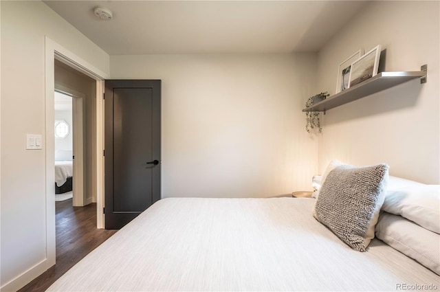 995 Chase St, Lakewood, CO 80214 - bedroom with dark wood-style floors and baseboards