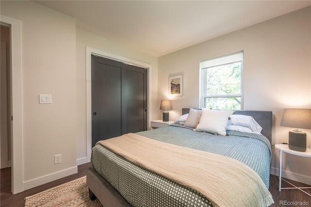 995 Chase St, Lakewood, CO 80214 - bedroom with a closet and dark wood finished floors
