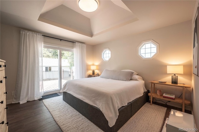 995 Chase St, Lakewood, CO 80214 - bedroom featuring a raised ceiling, access to outside, and wood finished floors