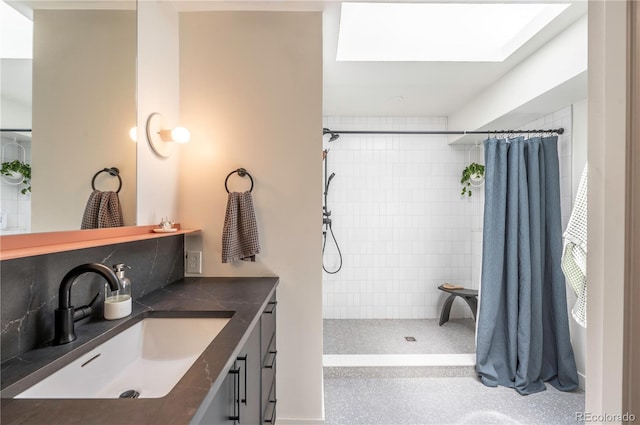 995 Chase St, Lakewood, CO 80214 - full bathroom featuring vanity and tiled shower