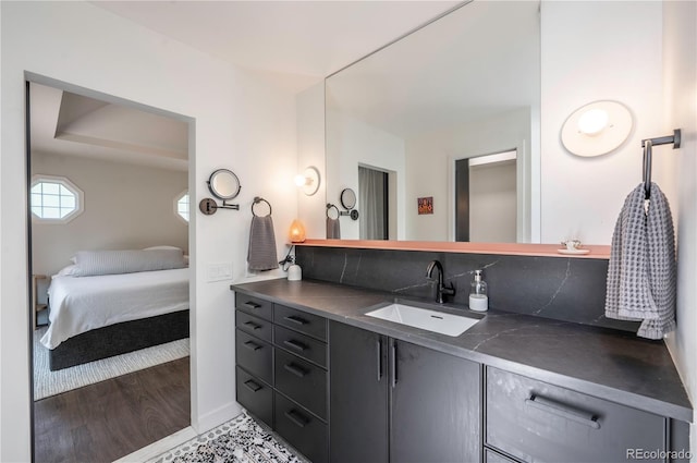 995 Chase St, Lakewood, CO 80214 - ensuite bathroom with vanity and wood finished floors
