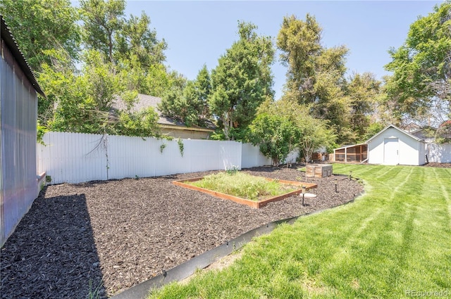 995 Chase St, Lakewood, CO 80214 - fenced backyard with a vegetable garden
