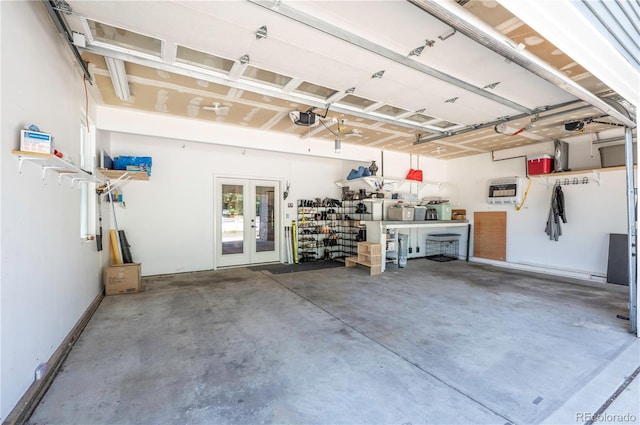 995 Chase St, Lakewood, CO 80214 - garage featuring french doors and a garage door opener