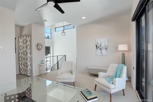 living area featuring recessed lighting, light carpet, and ceiling fan