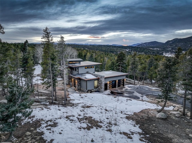 property view of mountains featuring a view of trees