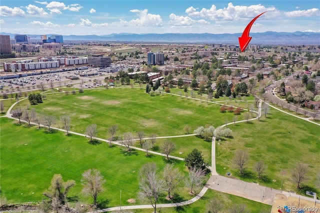 birds eye view of property with a mountain view