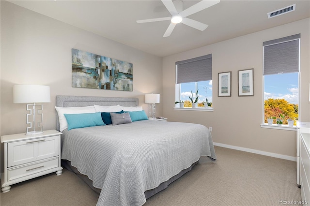 bedroom featuring carpet, baseboards, and a ceiling fan