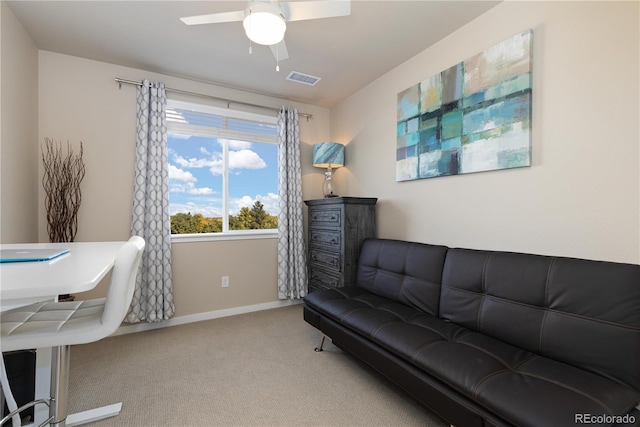 office area with carpet flooring, ceiling fan, and baseboards