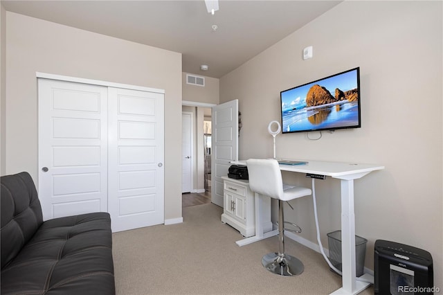 office space featuring light colored carpet and baseboards