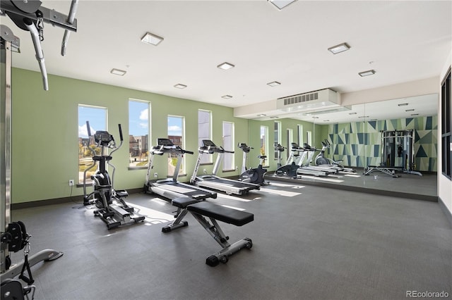 gym featuring baseboards