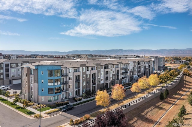 view of apartment building / complex featuring a mountain view