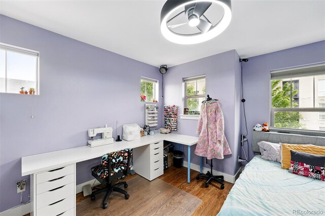 3644 Wabash St, Denver, CO 80238 - bedroom featuring a desk, wood finished floors, and baseboards