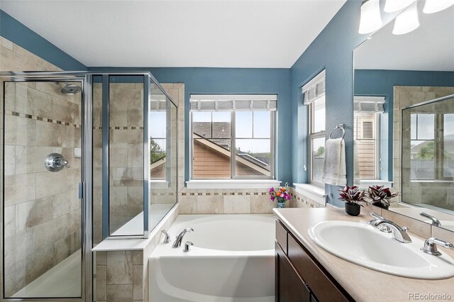 3644 Wabash St, Denver, CO 80238 - bathroom featuring vanity, a garden tub, and a stall shower