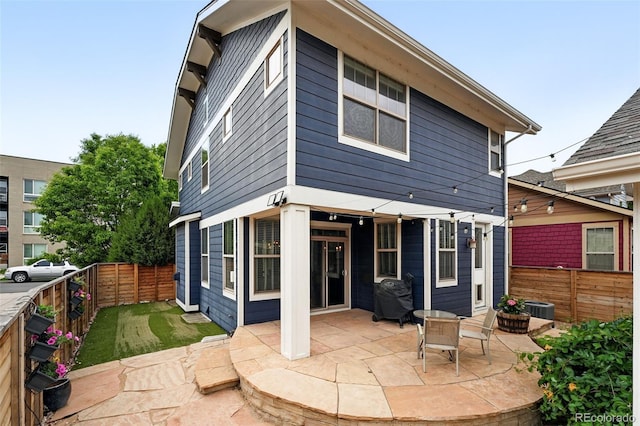 3644 Wabash St, Denver, CO 80238 - back of house with a fenced backyard and a patio area