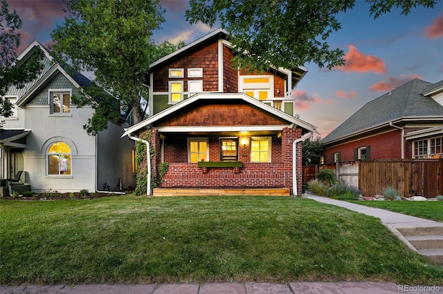 554 S Logan St, Denver, CO 80209 - view of front facade featuring a porch and brick siding