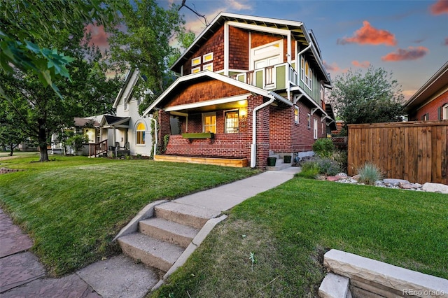 554 S Logan St, Denver, CO 80209 - view of front of property with covered porch, brick siding, and a balcony