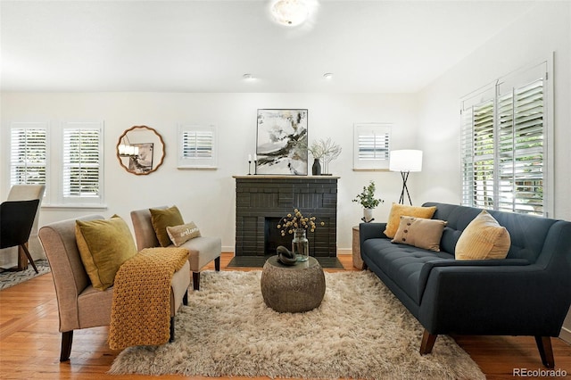 554 S Logan St, Denver, CO 80209 - living room with a fireplace and wood finished floors