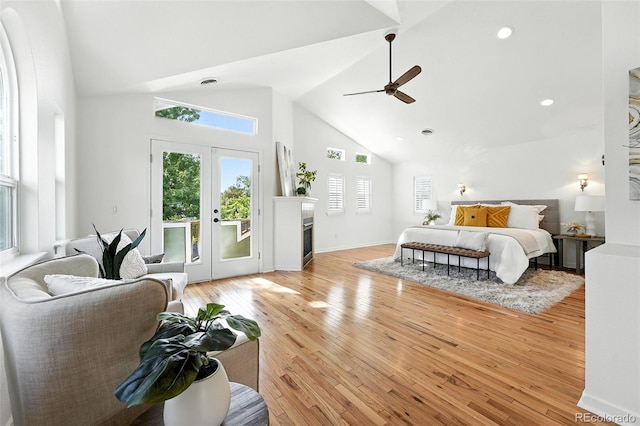554 S Logan St, Denver, CO 80209 - bedroom with high vaulted ceiling, access to outside, light wood-style floors, a ceiling fan, and french doors