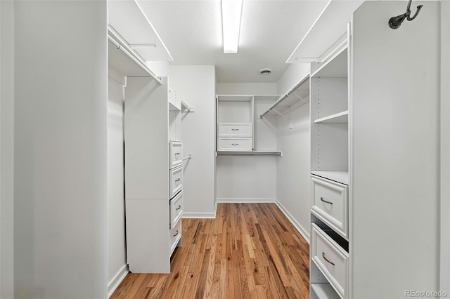 554 S Logan St, Denver, CO 80209 - spacious closet with light wood-type flooring