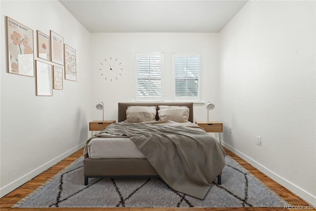 554 S Logan St, Denver, CO 80209 - bedroom with baseboards and wood finished floors