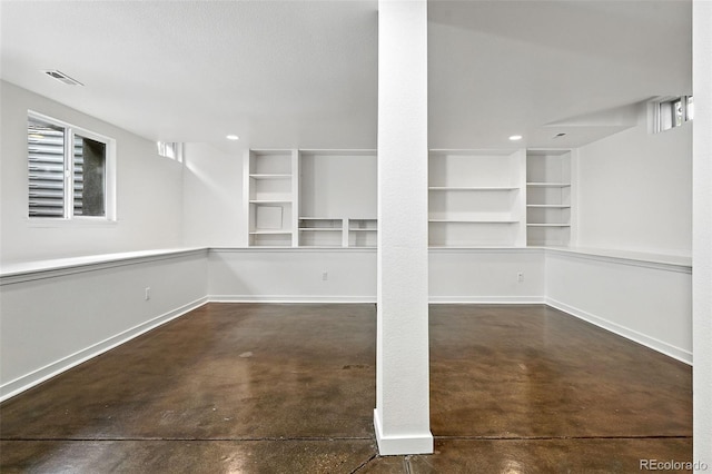554 S Logan St, Denver, CO 80209 - basement featuring built in shelves and recessed lighting