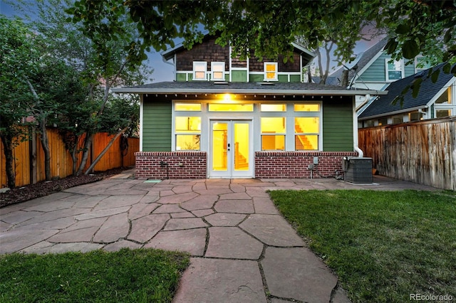 554 S Logan St, Denver, CO 80209 - back of house with brick siding, french doors, a fenced backyard, and a patio