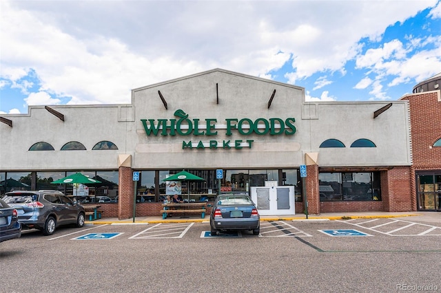 554 S Logan St, Denver, CO 80209 - view of commercial property featuring uncovered parking