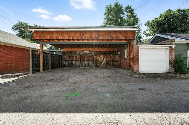 554 S Logan St, Denver, CO 80209 - view of car parking featuring asphalt driveway and a carport