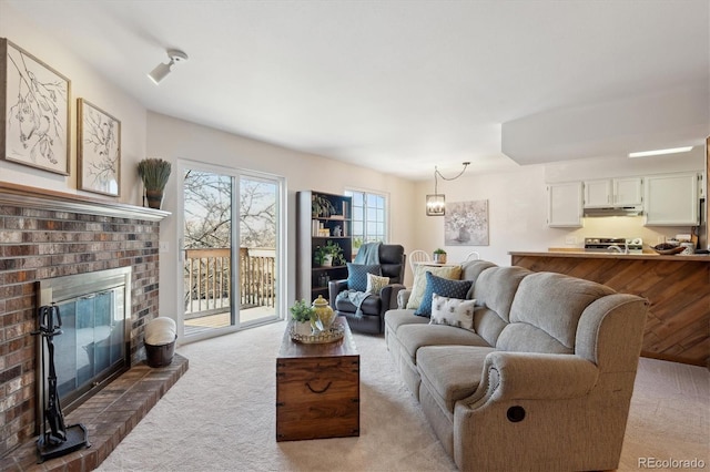 living area with carpet floors and a fireplace