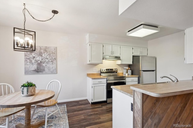 kitchen featuring under cabinet range hood, stainless steel appliances, a sink, light countertops, and dark wood finished floors