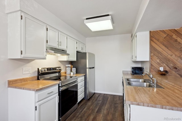 kitchen featuring dark wood-type flooring, stainless steel range with electric cooktop, under cabinet range hood, white cabinetry, and a sink