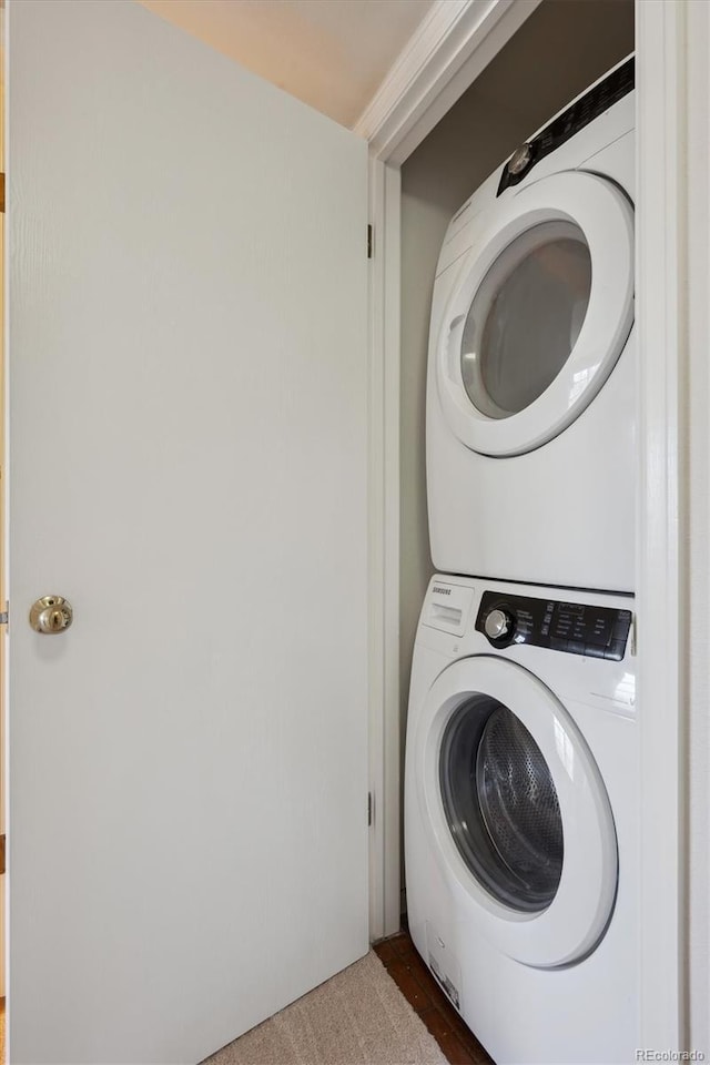 laundry room with laundry area and stacked washing maching and dryer