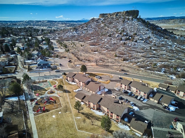 drone / aerial view featuring a residential view and a mountain view