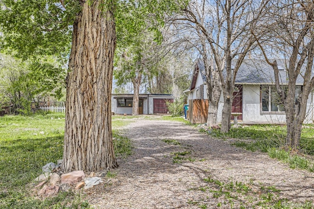 1115 W Quincy Ave, Englewood, CO 80110 - view of front of home featuring an outbuilding and fence
