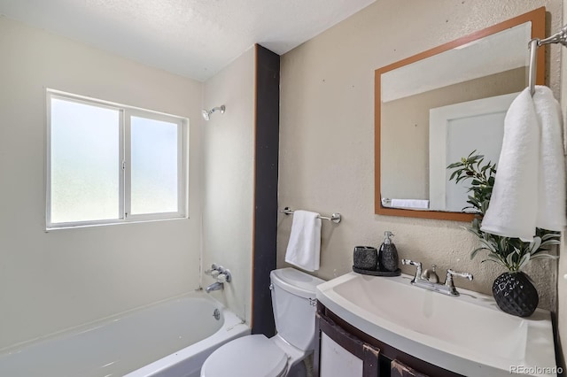 1115 W Quincy Ave, Englewood, CO 80110 - bathroom featuring toilet, vanity, shower / washtub combination, and a textured ceiling