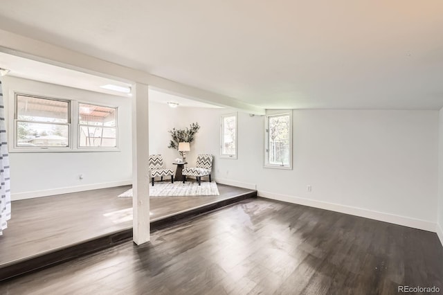 1115 W Quincy Ave, Englewood, CO 80110 - living area with dark wood-style flooring and baseboards