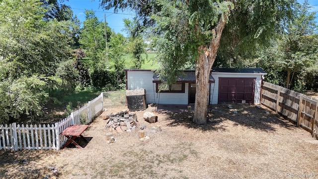 1115 W Quincy Ave, Englewood, CO 80110 - fenced backyard with a garage and driveway