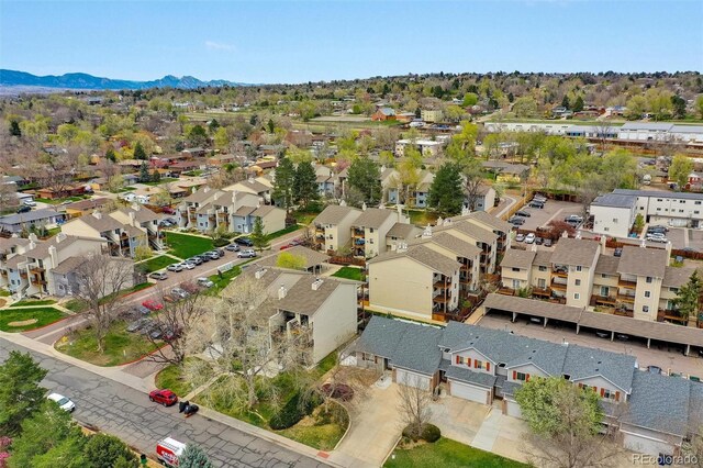 birds eye view of property featuring a mountain view and a residential view