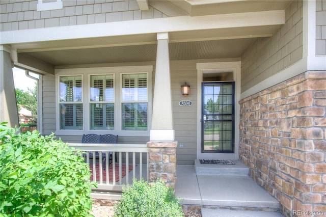 8594 W Quarto Ave, Littleton, CO 80128 - entrance to property featuring a porch