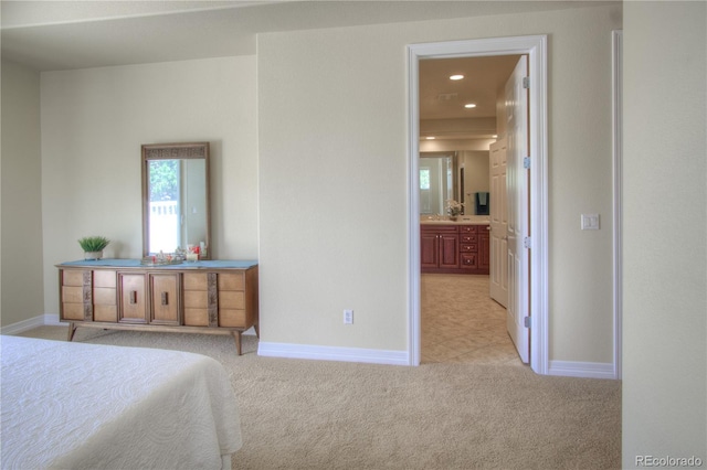 8594 W Quarto Ave, Littleton, CO 80128 - bedroom with light carpet, recessed lighting, and ensuite bath