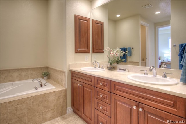 8594 W Quarto Ave, Littleton, CO 80128 - full bathroom with double vanity, a bath, and tile patterned floors