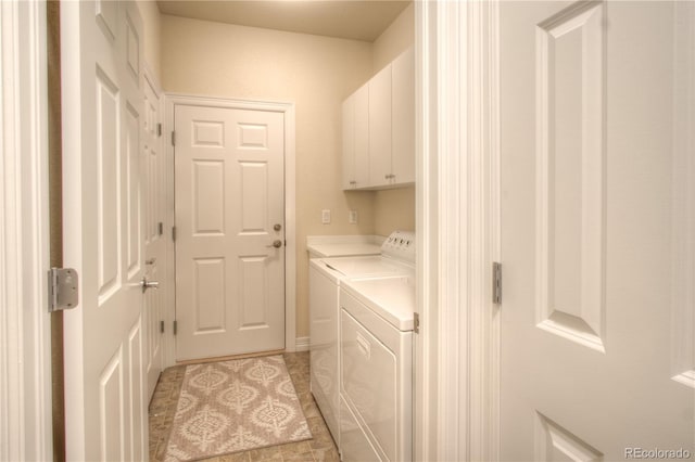 8594 W Quarto Ave, Littleton, CO 80128 - washroom featuring cabinet space, washing machine and dryer, and light tile patterned floors